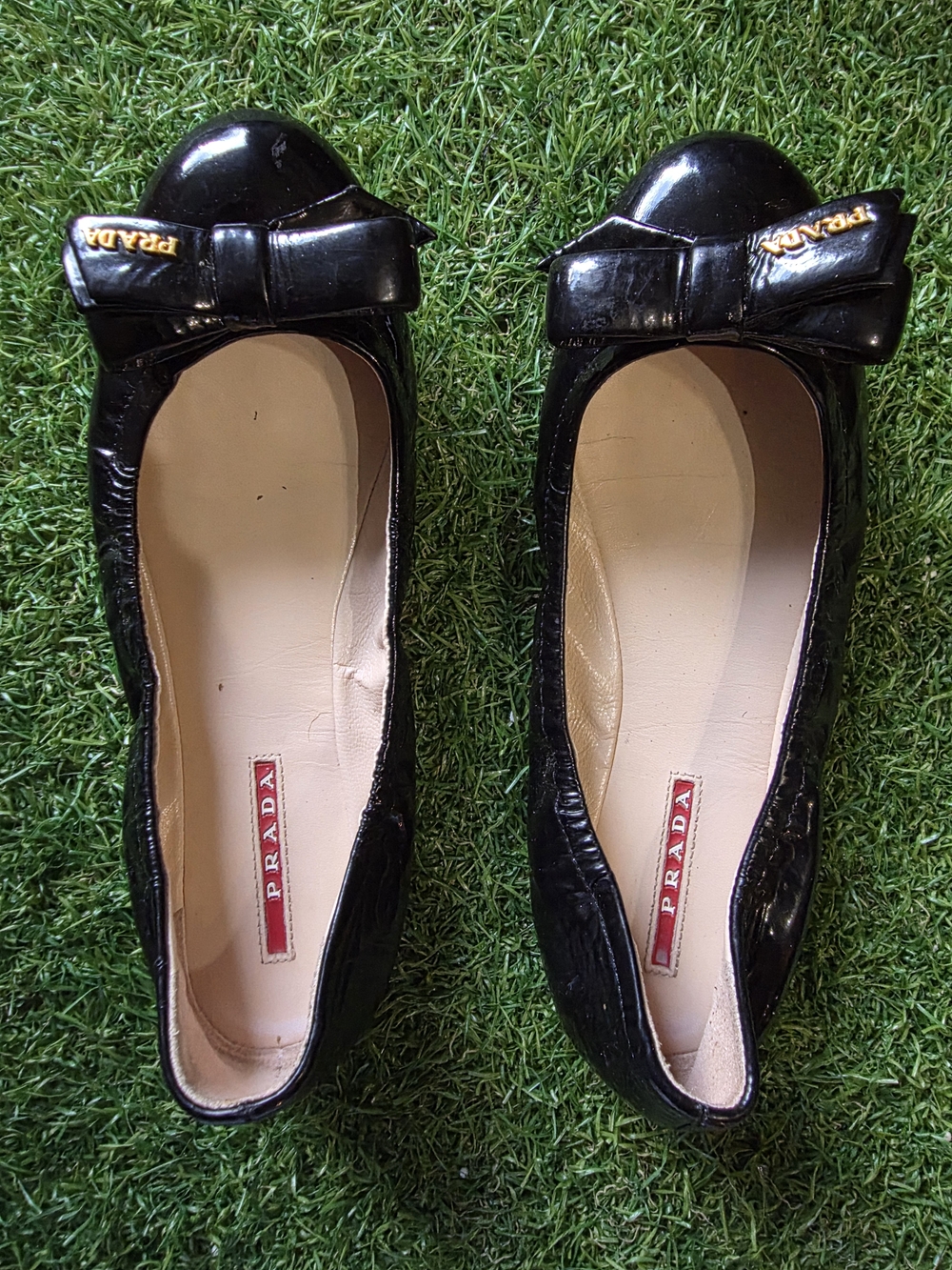 Prada Black Patent Leather Bow Flats with Gold Logo